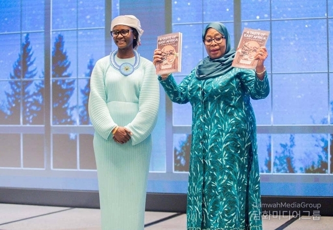President of Tanzania, Her Excellency Samia Suluhu Hassan (right), poses with Chaba Rhuwanya Mavura with the cookbook officially launched on June 5, 2024.